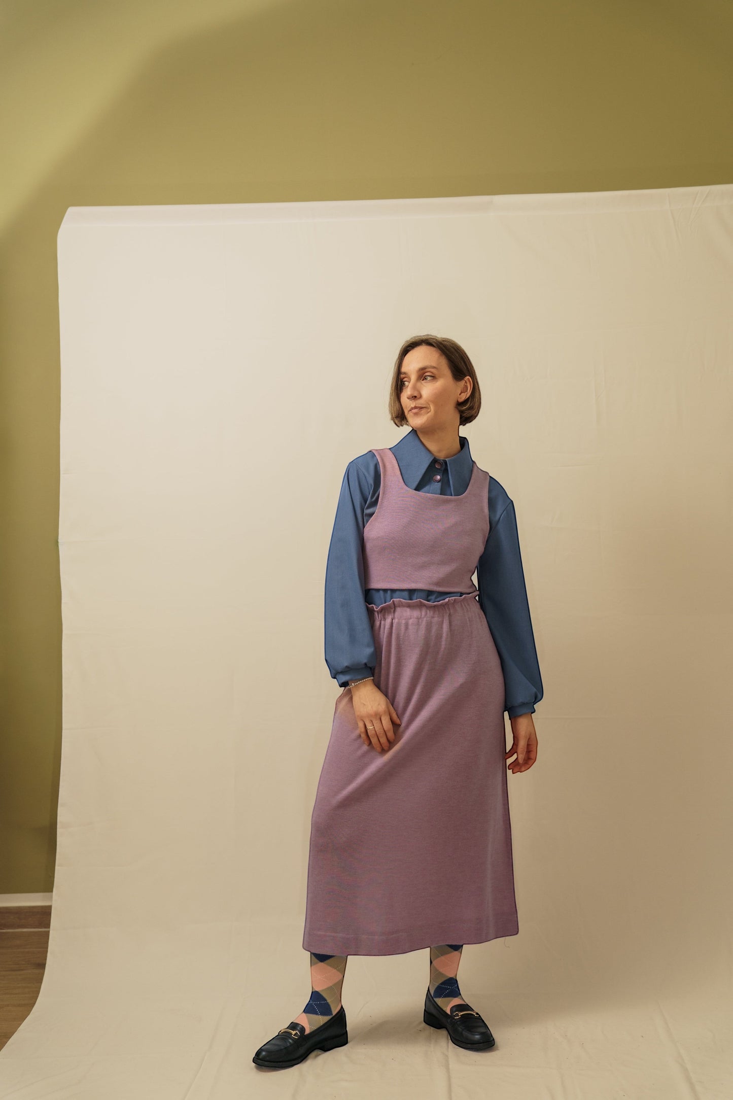 Invogue Again Malva mauve knit crop top layered over a blue collared shirt and matching midi skirt