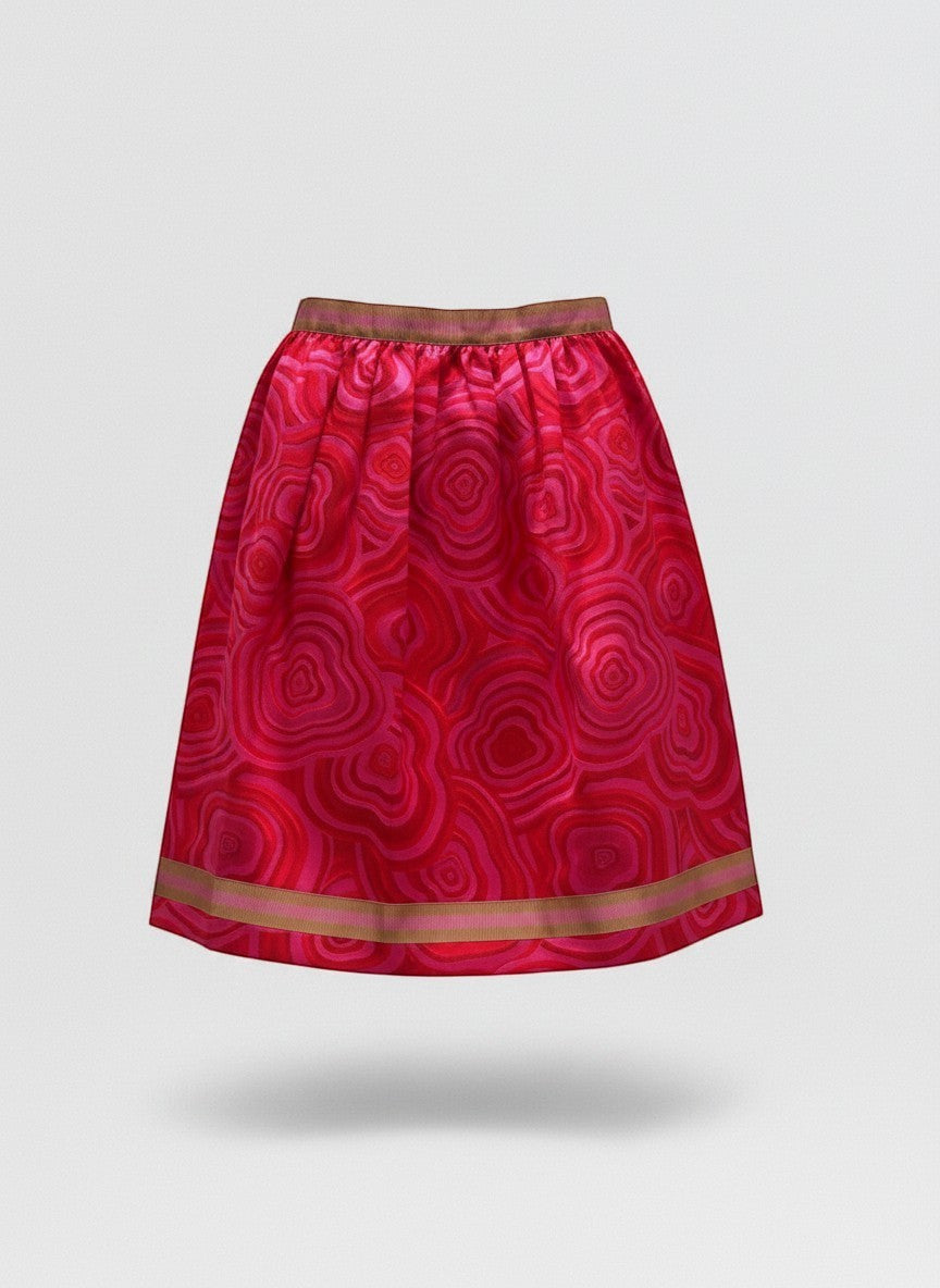 Gonna a pieghe Invogue Again con motivo geometrico rosa e rosso, realizzata in cotone e viscosa con nastro a contrasto.
