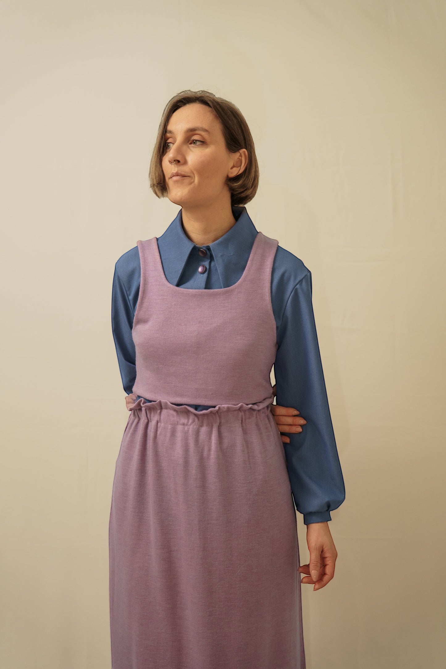 Invogue Again lavender knit crop top layered over a blue collared shirt and matching skirt