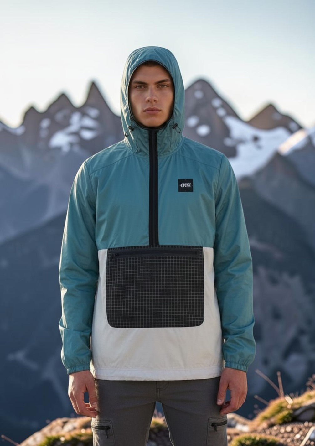 Invogue Again Picture Wailer JKT windbreaker in arctic blue with a grid-patterned front pocket and half-zip hood.
