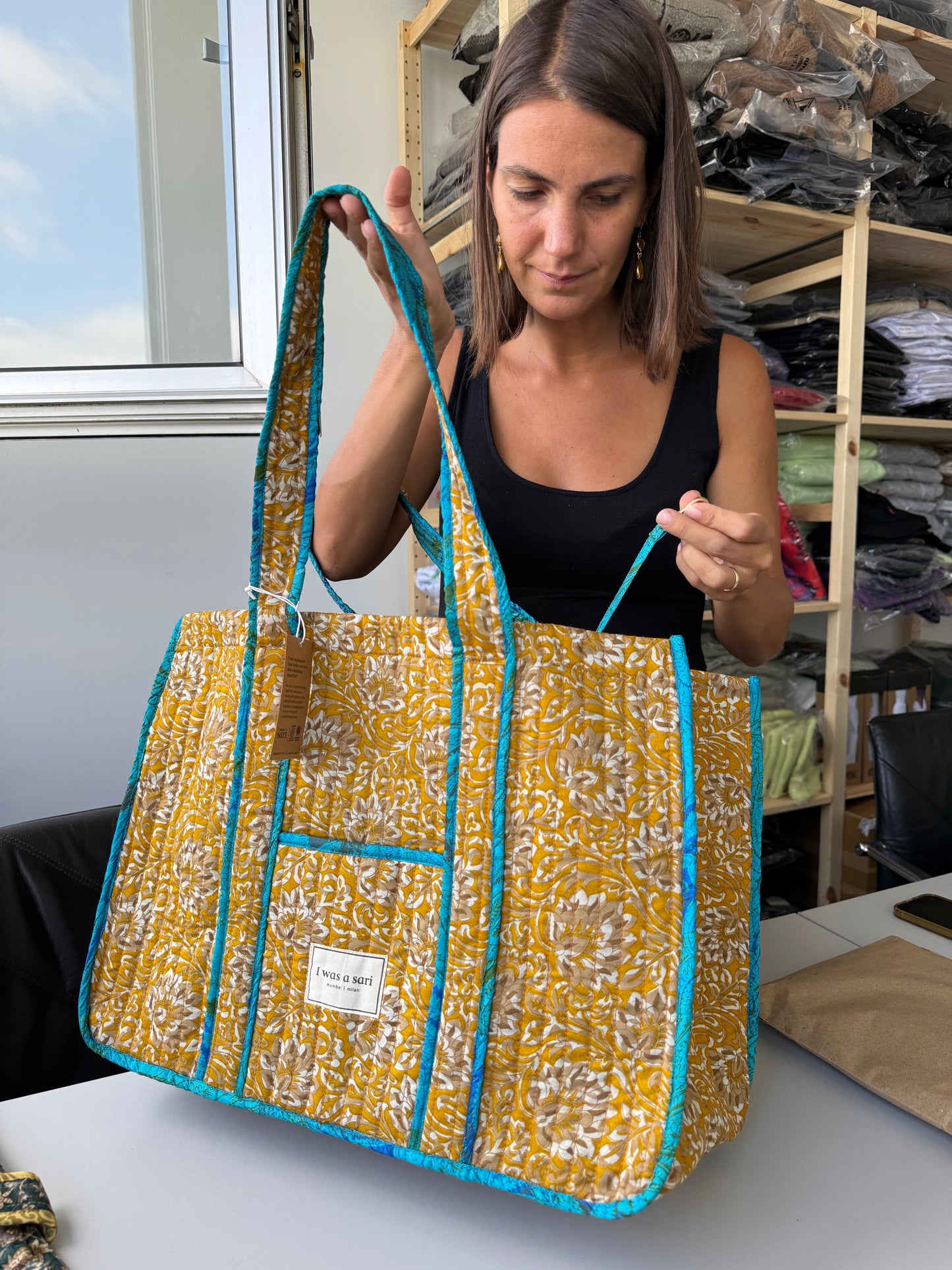 Invogue Again quilted work tote bag in yellow and white floral sari fabric with bright blue trim and shoulder straps.