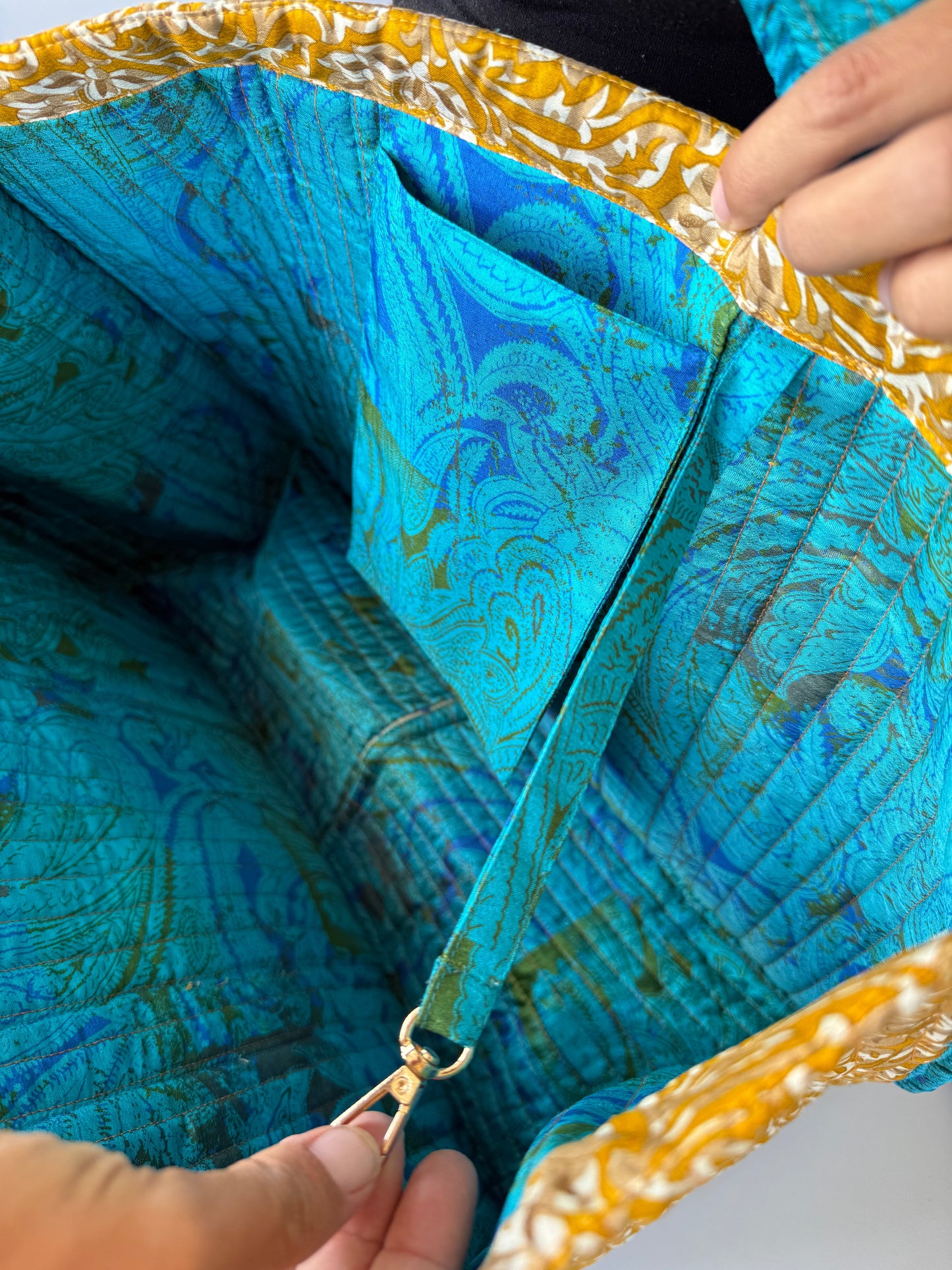 Invogue Again quilted work tote bag interior with blue paisley sari lining and a secure zippered pocket.
