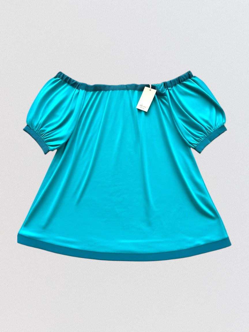 Turquoise off-shoulder top with a tag on a light gray background